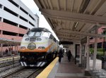 MP32PH-Q # 105 is on the back of Sunrail train # P323 at AventHealth Station